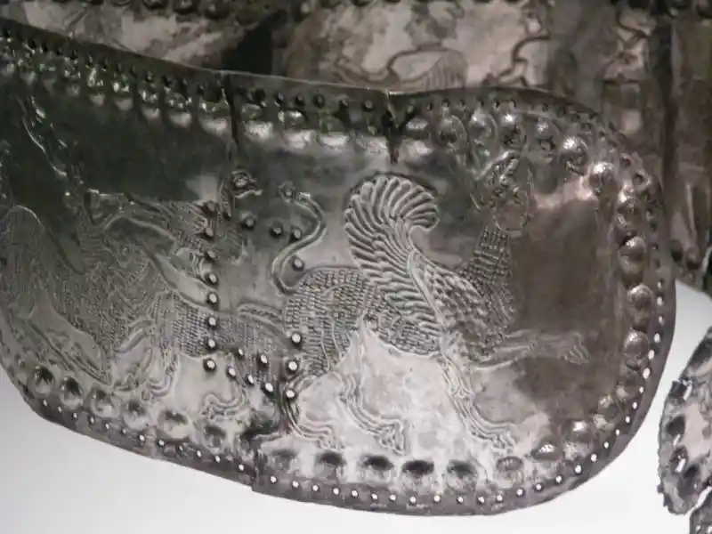 Gold belt with depiction of sphinx and other animals